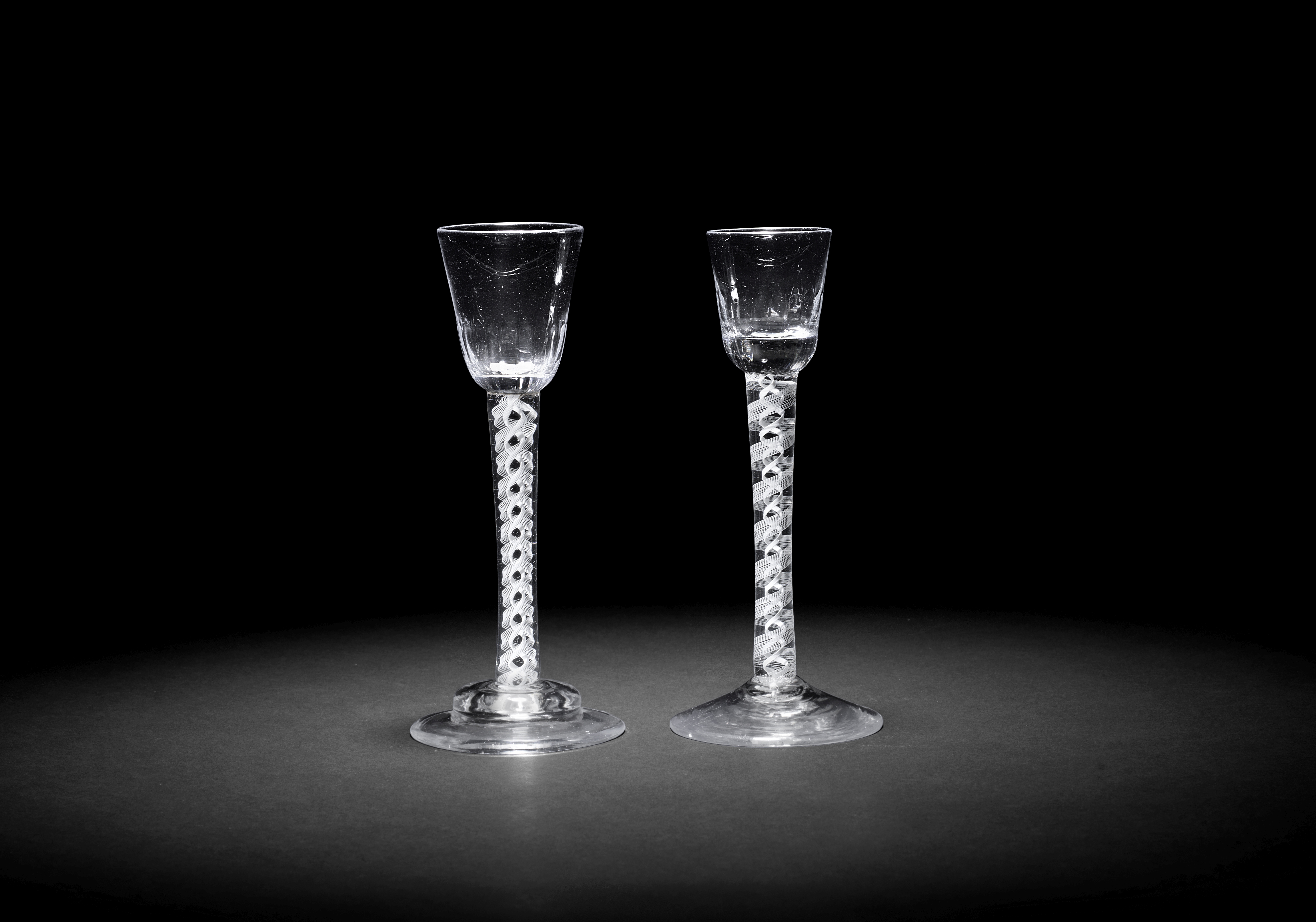 Two tall opaque twist cordial glasses, circa 1765