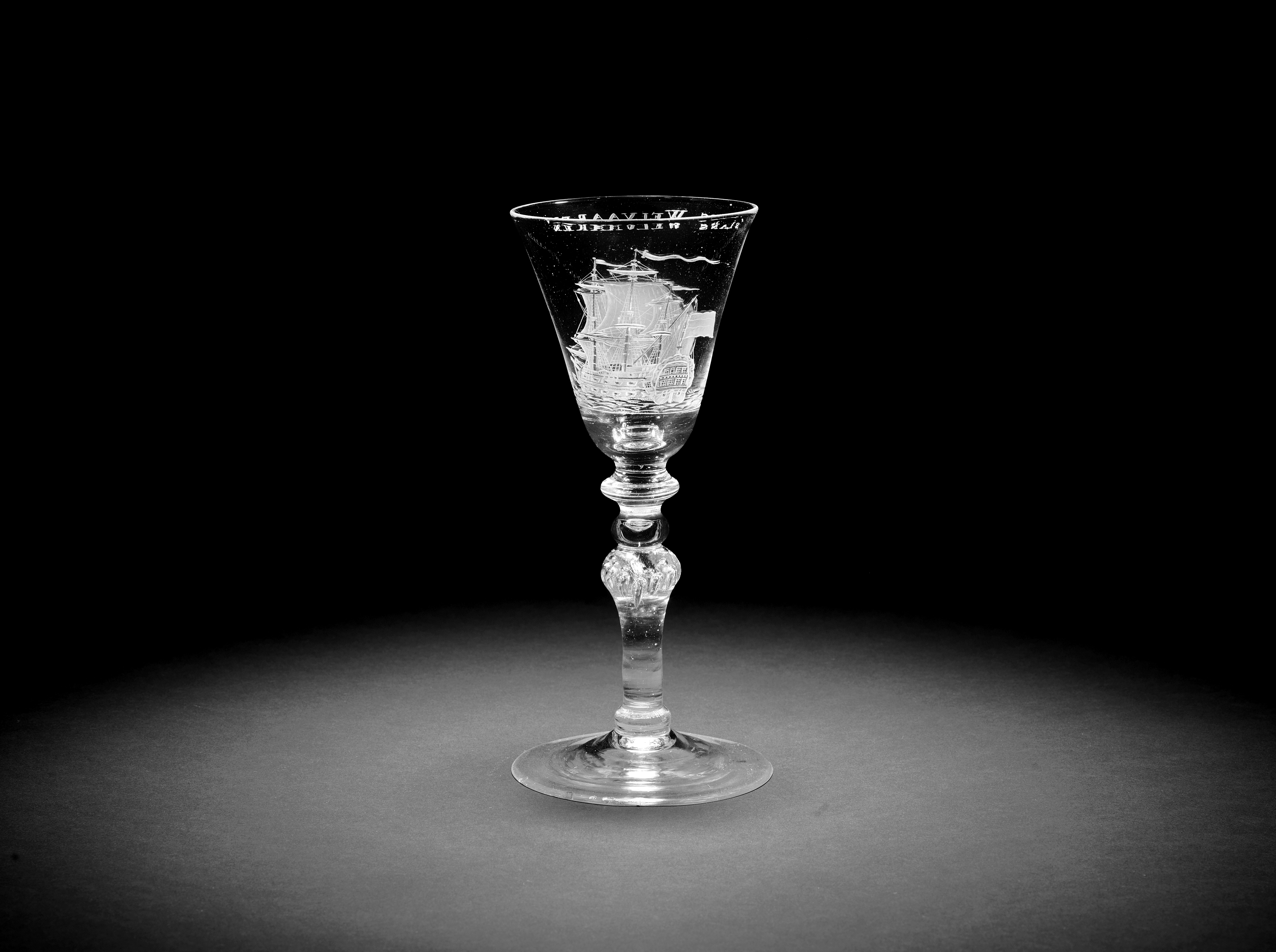 A Dutch engraved light baluster wine goblet attributed to Jacob Sang, circa 1760