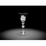 A Dutch engraved light baluster wine goblet attributed to Jacob Sang, circa 1760