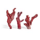 A set of three composition faux red coral ornaments (3)