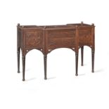 A Regency gothic revival oak breakfront dressing table after a design by George Smith