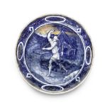 A late 16th / early 17th century Limoges enamel plate depicting a huntsman and a hound