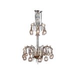An early 20th century cut glass and polished brass eighteen light chandelier, attributed to F & ...