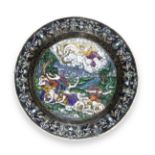 A 19th century Limoges enamel charger decorated with a scene of Artemis and Apollo killing the ch...