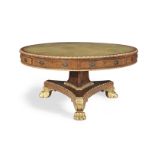 A large Regency pollard oak and parcel gilt drum top library table