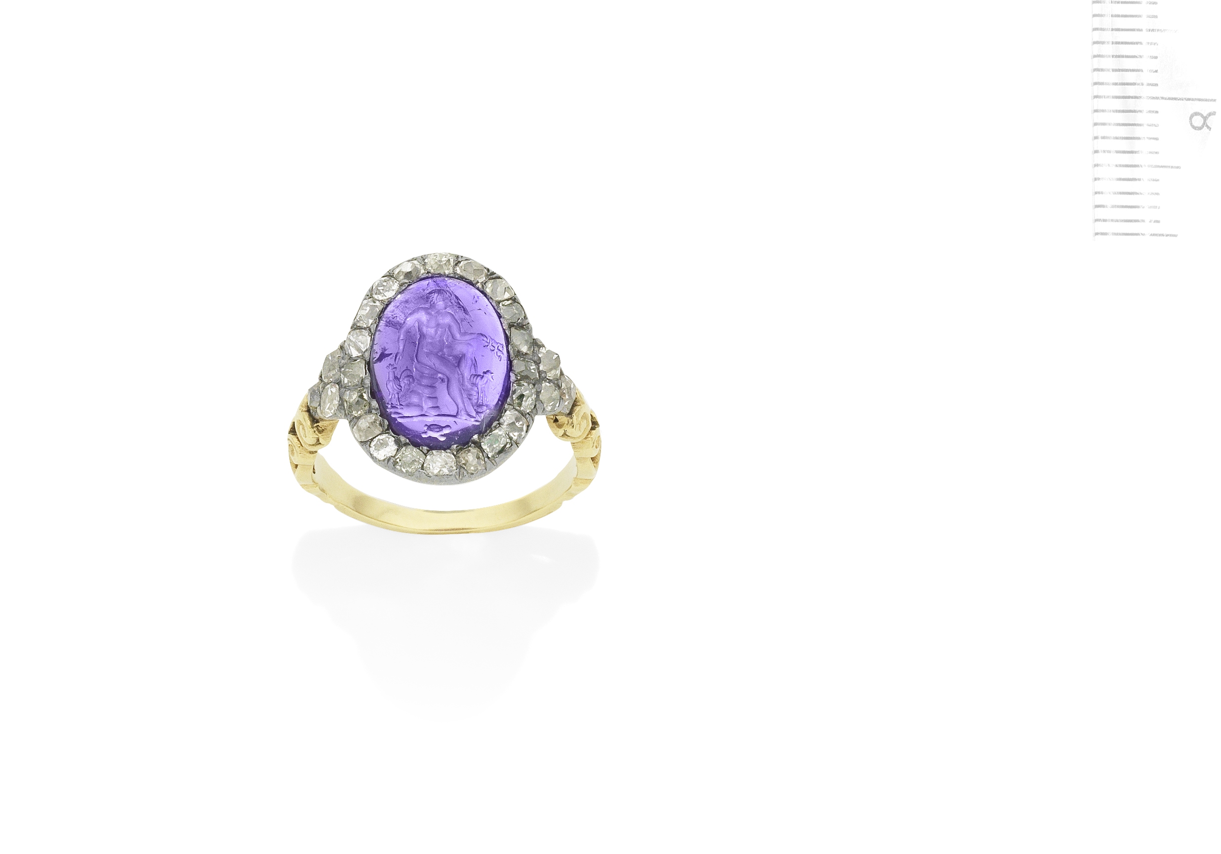 An antique amethyst intaglio and diamond cluster ring