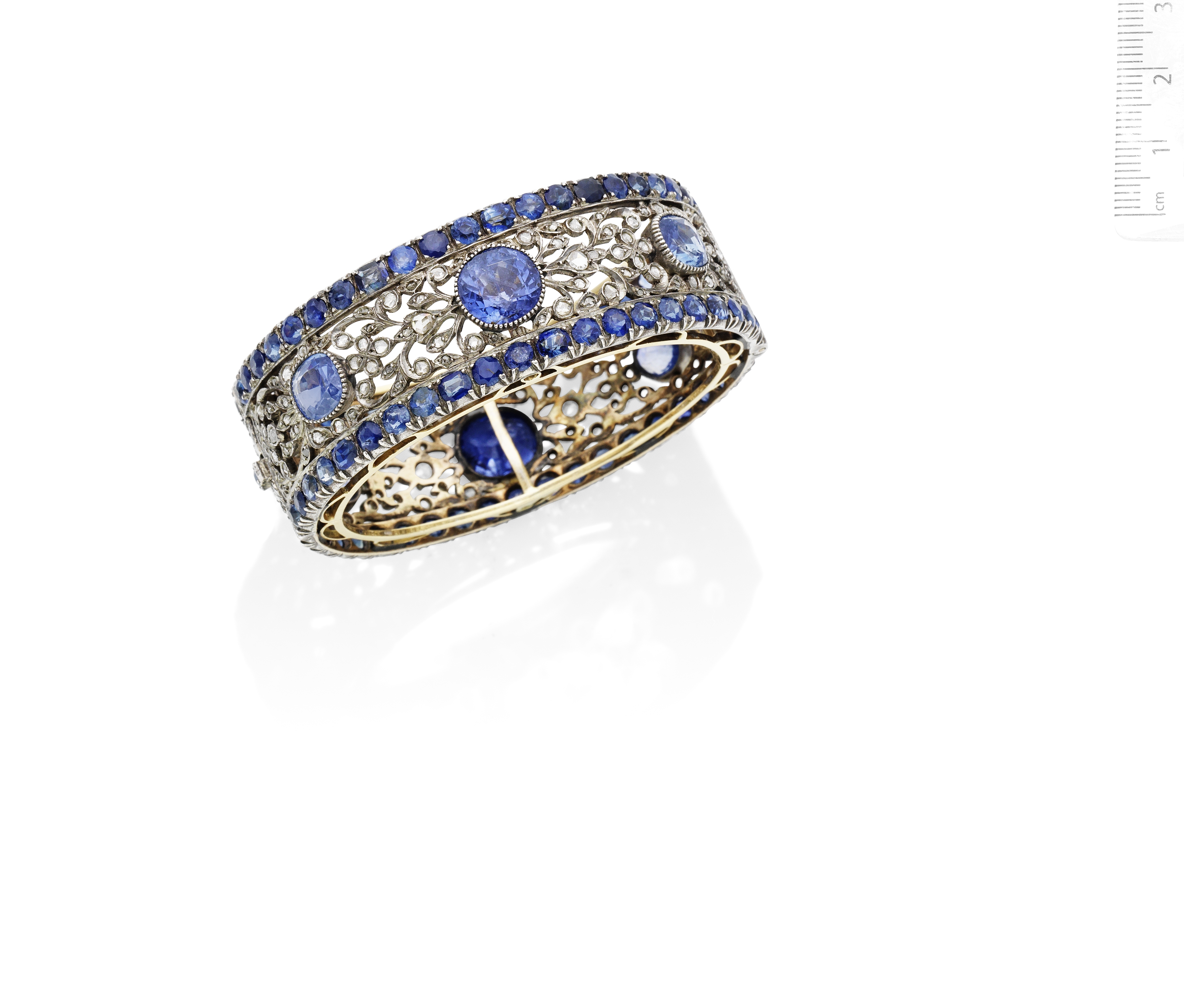 A mid 20th century sapphire and diamond bangle