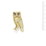 A sapphire and gold owl brooch, by Cartier,