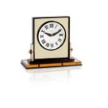 an art deco mother-of-pearl, gilt metal, enamel and corallium rubrum mirrored desk clock by Cartier,