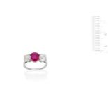 A mid 20th Century pink sapphire and diamond three-stone ring