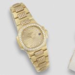 Patek Philippe. A lady's 18K gold and diamond set quartz calendar bracelet watch Nautilus, Ref: 4...