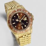 Rolex. An 18K gold automatic calendar bracelet watch with dual time zone GMT-Master, Ref: 16758,...