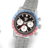Heuer. A stainless steel manual wind chronograph bracelet watch with dual time zone Autavia GMT,...