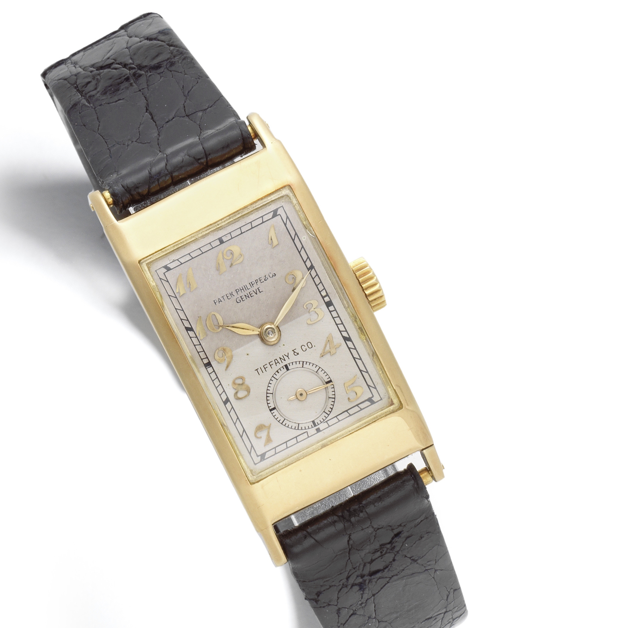 Patek, Philippe & Co, Geneve. A rare double signed 18K gold manual wind rectangular wristwatch re...