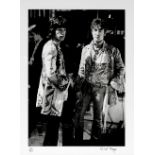 DAVID MAGNUS (BRITISH, B.1944): A black and white silver gelatin print of John Lennon and Mick Ja...