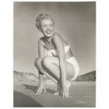 ANDRE DE DIENES (ROMANIAN/AMERICAN, B.1913-D.1985): a black and white print of Marilyn Monroe on ...