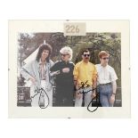 Queen: An autographed colour photograph, circa 1985,