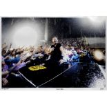 Jo Lopez: Bruce Springsteen singing on stage in the rain, Florence, Italy, 2012,