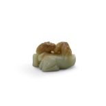 A small green and brown jade carving of a horse group Qing dynasty