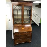 A Georgian bureau bookcase, with Shell design inlay. Measures 211x100x48cm