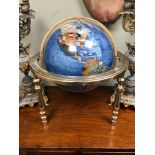 A Large precious stone desk globe. Measures 52cm in height.