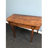 A late Victorian D-End card table. Styled with Inlays and spade Supporting legs.