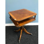 A Reproduction yew wood pedestal side table. Styled with claw castor feet. Measures 57cm in height.