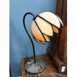 A Tiffany style lamp, designed with a lily pad base. Working