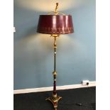 Antique floor standing heavy brass standard lamp, designed with red panels and shade. Styled with