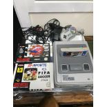 Super Nintendo Console with games and controller.