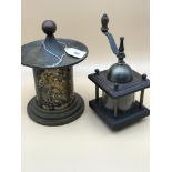 An oriental detailed cigarette dispenser & pepper grinder.