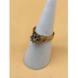 A 9ct gold ladies ring styled with single diamond, size J. 3.44g in weight