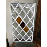 A Georgian cast iron diamond shaped stainglass window panel. Measures 73x41cm (Original glass)