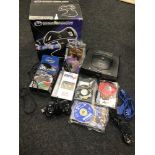 A Sega Saturn console, Loose games and boxed games, 2 Controllers and steering wheel.