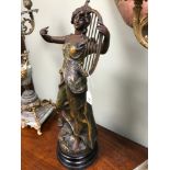 Bronzed Spelter lady figurine sat upon a wooden plinth. measures 52cm in height.
