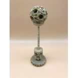 Victorian carved puzzle ball and stand done in an oriental manner. Stands 20cm in height