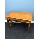 A Victorian light oak 2 drawer desk styled with Harp shaped ends. Comes with Key. Measures