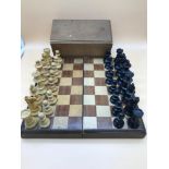 Antique chess board and hand turned chess pieces in the style of Staunton, possibly earlier