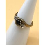 A 9ct gold ladies diamond and sapphire set ring. Size I, weighs 2.04g