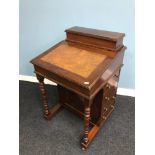 An Antique Davenport writing desk. fitted with 4 drawers to the side and fitted interior. On