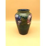 Moorcroft Anemone design vase. Design includes large open, bulbous flowers and elongated foliage.