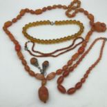 A lot of various amber, bakelite and glass bead necklaces