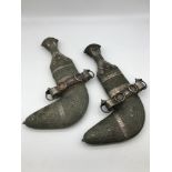 A Pair Early 20th century Arab Jambiya daggers with silver filigree decoration. From Saudi Arabia,