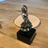 A hallmarked solid silver flamenco dancer supported on a plastic base. Measures 8.5cm in height