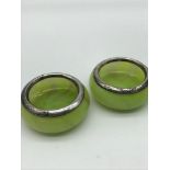 A Pair of London silver rimmed mustard pots, Designed with Art Deco green glass bases.