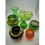 A collection of various green vaseline glass, together with a pottery bowl