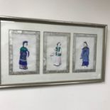 Original oriental paintings of 3 figures done on rice paper. Framed within a silver frame. Frame