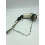 A Silver mounted drinking horn. Has a carry chain attached. Measures 11x22x4.5cm