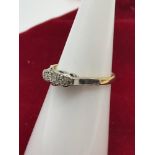 18CT Gold & Platinum ladies ring set with 3 diamonds. Size J.