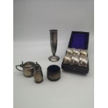 A mixed lot to include three Birmingham silver salt pots, EP napkin rings & EP flute